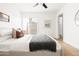 Light, airy bedroom with natural light, hardwood floors, and sliding doors to a private outdoor space at 1631 E Gardenia Ave, Phoenix, AZ 85020