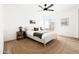 Bright bedroom with a neutral palette, ceiling fan and sliding door access to the outside patio at 1631 E Gardenia Ave, Phoenix, AZ 85020