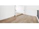 Hallway with light wood flooring and white walls providing access to upper-level rooms at 1631 E Gardenia Ave, Phoenix, AZ 85020