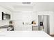Contemporary kitchen featuring stainless steel appliances, white cabinetry, and ample counter space at 1631 E Gardenia Ave, Phoenix, AZ 85020