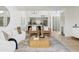 Bright and spacious living room with modern furniture and an open floor plan to the kitchen at 1631 E Gardenia Ave, Phoenix, AZ 85020
