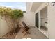 Outdoor patio featuring lush vegetation and seating space, accessible through sliding glass doors at 1631 E Gardenia Ave, Phoenix, AZ 85020