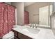 Well-lit bathroom featuring a decorative granite countertop and sink at 1650 S Crismon Rd # 13, Mesa, AZ 85209