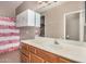 Bathroom featuring an oak vanity and a shower and tub combo at 1650 S Crismon Rd # 13, Mesa, AZ 85209