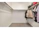 Walk-in closet with shelves and wooden rods at 1650 S Crismon Rd # 13, Mesa, AZ 85209