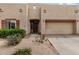 Charming home featuring an attached two-car garage and low maintenance desert landscaping at 1650 S Crismon Rd # 13, Mesa, AZ 85209