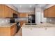 Kitchen featuring granite countertops and wood cabinetry at 1650 S Crismon Rd # 13, Mesa, AZ 85209