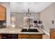 Kitchen island with granite countertops and stainless steel faucet at 1650 S Crismon Rd # 13, Mesa, AZ 85209