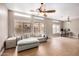 Spacious living room with tile flooring, ceiling fan, and multiple windows at 1650 S Crismon Rd # 13, Mesa, AZ 85209