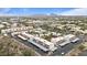 A scenic aerial view showcasing residential buildings, covered parking, and desert landscaping with mountain views at 16510 E Palisades Blvd # 42, Fountain Hills, AZ 85268