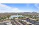 Aerial view of commercial properties and a lake with a fountain surrounded by mountain views at 16510 E Palisades Blvd # 42, Fountain Hills, AZ 85268