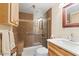 Well-lit bathroom featuring a tiled shower with a bench, modern fixtures, and a stylish vanity at 16510 E Palisades Blvd # 42, Fountain Hills, AZ 85268