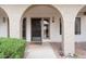 Inviting front entrance with covered archway, decorative door, and low-maintenance desert landscaping at 16510 E Palisades Blvd # 42, Fountain Hills, AZ 85268