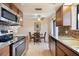 Well-equipped kitchen featuring stainless steel appliances, granite countertops, and mosaic tile backsplash at 16510 E Palisades Blvd # 42, Fountain Hills, AZ 85268