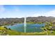 Picturesque lake with a fountain surrounded by parks and mountains with residential areas in the distance at 16510 E Palisades Blvd # 42, Fountain Hills, AZ 85268