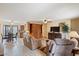 Cozy living room featuring tile flooring, ceiling fan, comfortable seating, and view of dining area at 16510 E Palisades Blvd # 42, Fountain Hills, AZ 85268