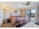Bedroom with a decorative bed, ceiling fan, carpet and sliding door to the exterior at 16510 E Palisades Blvd # 42, Fountain Hills, AZ 85268
