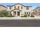 Beautiful two-story home featuring a charming facade, landscaped front yard and neutral color scheme at 16540 W Culver St, Goodyear, AZ 85338