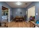Traditional dining room featuring hardwood floors, neutral paint, and access to other living areas at 1712 E Montebello Ave, Phoenix, AZ 85016