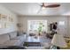 Bright, inviting living room with a bay window, neutral color scheme, plush carpet, and ample space for relaxation at 1712 E Montebello Ave, Phoenix, AZ 85016