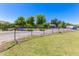 Expansive backyard with a fence and plenty of space for parking vehicles and an RV at 18051 E Happy Rd, Queen Creek, AZ 85142