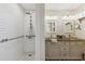 Bright bathroom with a subway tile shower and a double sink vanity, providing a clean and modern design at 18051 E Happy Rd, Queen Creek, AZ 85142