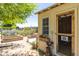This charming chicken coop features a rustic design and offers a delightful touch to the property at 18051 E Happy Rd, Queen Creek, AZ 85142