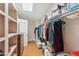 Walk-in closet offering ample storage with built-in shelving and clothing racks at 18051 E Happy Rd, Queen Creek, AZ 85142