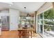 Dining area featuring a wooden table and outdoor access at 18051 E Happy Rd, Queen Creek, AZ 85142