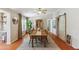 Elegant dining room with hardwood floors and barn doors at 18051 E Happy Rd, Queen Creek, AZ 85142