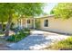 Beautiful front entrance featuring a porch and flower garden at 18051 E Happy Rd, Queen Creek, AZ 85142