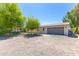 Exterior view of the attached garage and the front of the house at 18051 E Happy Rd, Queen Creek, AZ 85142