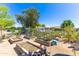 This beautiful garden features raised garden beds filled with blooming flowers and lush greenery at 18051 E Happy Rd, Queen Creek, AZ 85142