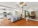 Open-concept kitchen and dining area with a spacious island, ample seating, and modern appliances at 18051 E Happy Rd, Queen Creek, AZ 85142