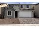 Charming two-story home featuring a two-car garage and neutral stucco finish at 18183 W Larkspur Dr, Goodyear, AZ 85338