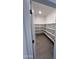 Walk-in pantry with tiled floor and wall-to-wall shelving at 18183 W Larkspur Dr, Goodyear, AZ 85338