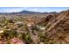 Aerial view of mountain home featuring a private pool and overlooking a sprawling cityscape at 1836 E Turquoise Ave, Phoenix, AZ 85020