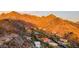 Breathtaking aerial perspective showcasing desert homes nestled in the mountains, featuring red-tiled roofs at 1836 E Turquoise Ave, Phoenix, AZ 85020
