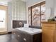 Bright bathroom features an enclosed glass shower, a soaking tub, and a scenic view at 1836 E Turquoise Ave, Phoenix, AZ 85020