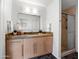 Modern bathroom with sleek vanity, stylish fixtures, and glass-enclosed shower at 1836 E Turquoise Ave, Phoenix, AZ 85020