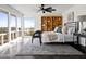 Bright bedroom boasts large windows, and a cozy rug on stylish tiled flooring at 1836 E Turquoise Ave, Phoenix, AZ 85020