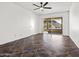 A bedroom featuring tile floors, ceiling fan, and sliding glass doors leading to an outdoor deck with mountain views at 1836 E Turquoise Ave, Phoenix, AZ 85020