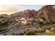 A hillside home features multiple balconies, offering stunning views and modern architecture amidst the natural landscape at 1836 E Turquoise Ave, Phoenix, AZ 85020