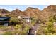 A hillside home featuring multiple balconies, showcasing natural surroundings, with lush greenery at 1836 E Turquoise Ave, Phoenix, AZ 85020
