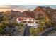 Luxury hillside home with red tile roof and long driveway winding through desert landscape at 1836 E Turquoise Ave, Phoenix, AZ 85020