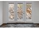 Rock wall with door that accesses a scenic outdoor view of the area at 1836 E Turquoise Ave, Phoenix, AZ 85020