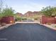 Gated entrance to Pinnabar Canyon Estates, with desert landscape and mountain views at 1836 E Turquoise Ave, Phoenix, AZ 85020