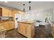 Bright kitchen featuring an island, granite counters and stainless appliances at 1836 E Turquoise Ave, Phoenix, AZ 85020