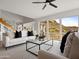 Open-concept living area with modern furniture and scenic mountain views from windows at 1836 E Turquoise Ave, Phoenix, AZ 85020