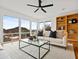 Bright and airy living room with large windows and cozy seating arrangement at 1836 E Turquoise Ave, Phoenix, AZ 85020